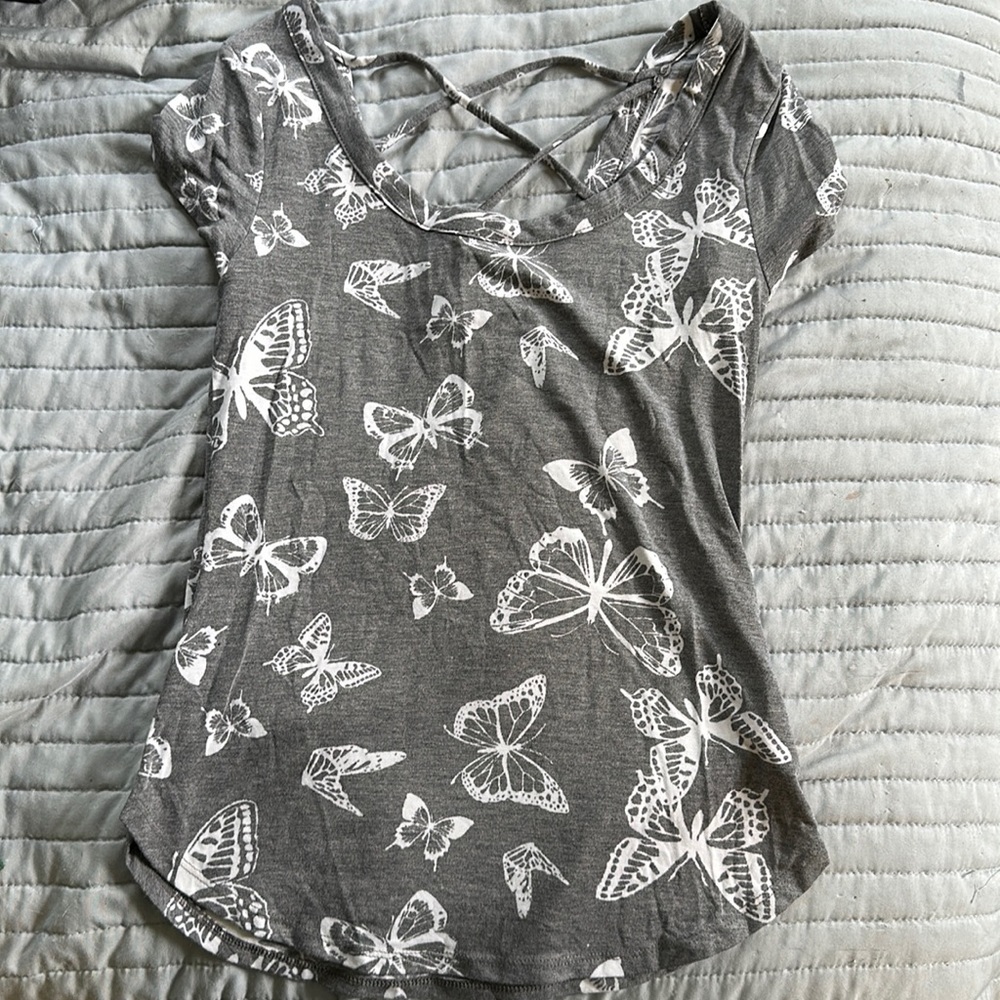 I am selling a cross back strap butterfly shirt